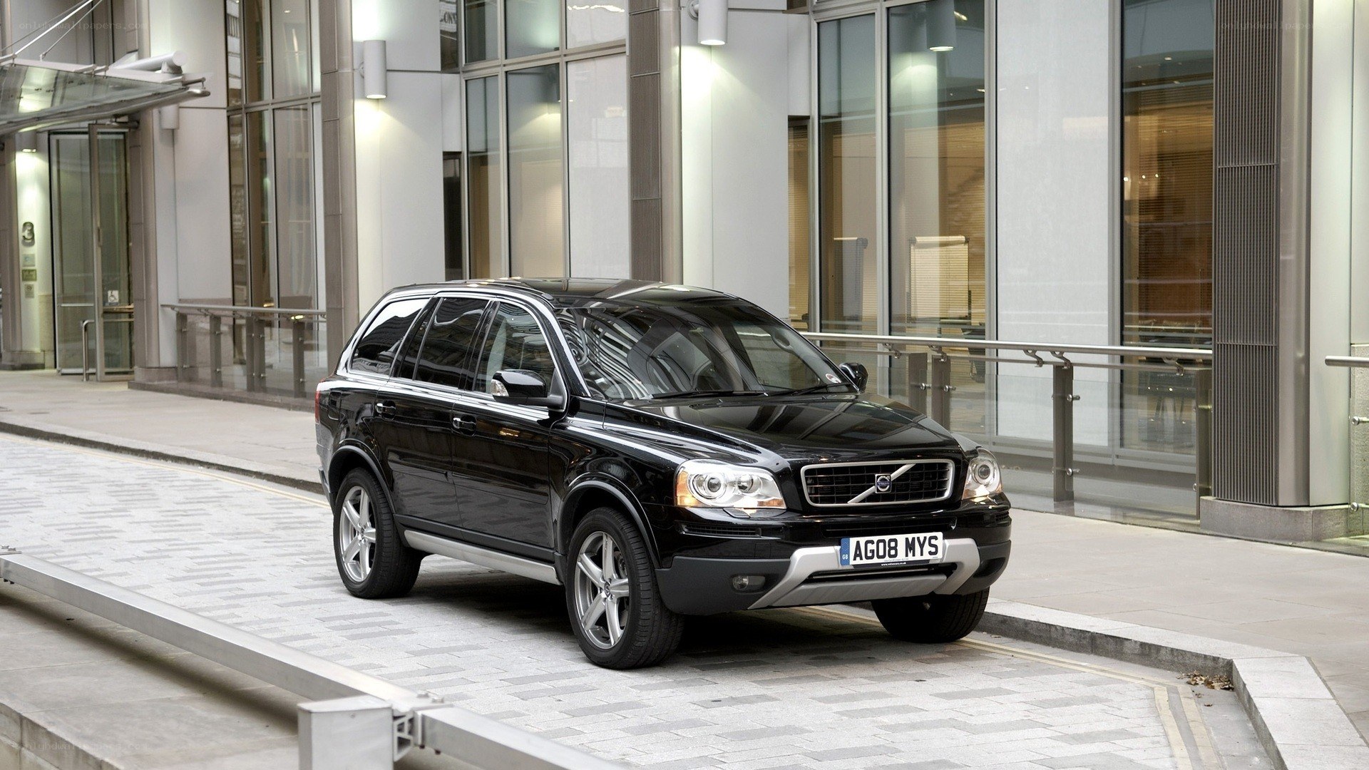 Black Volvo XC90 parked outside building