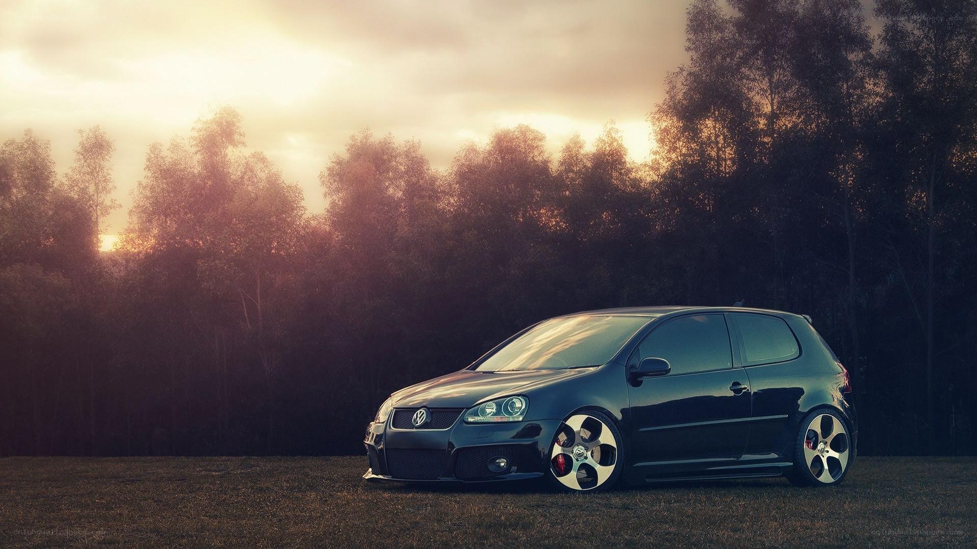 Black VW Golf in sunset