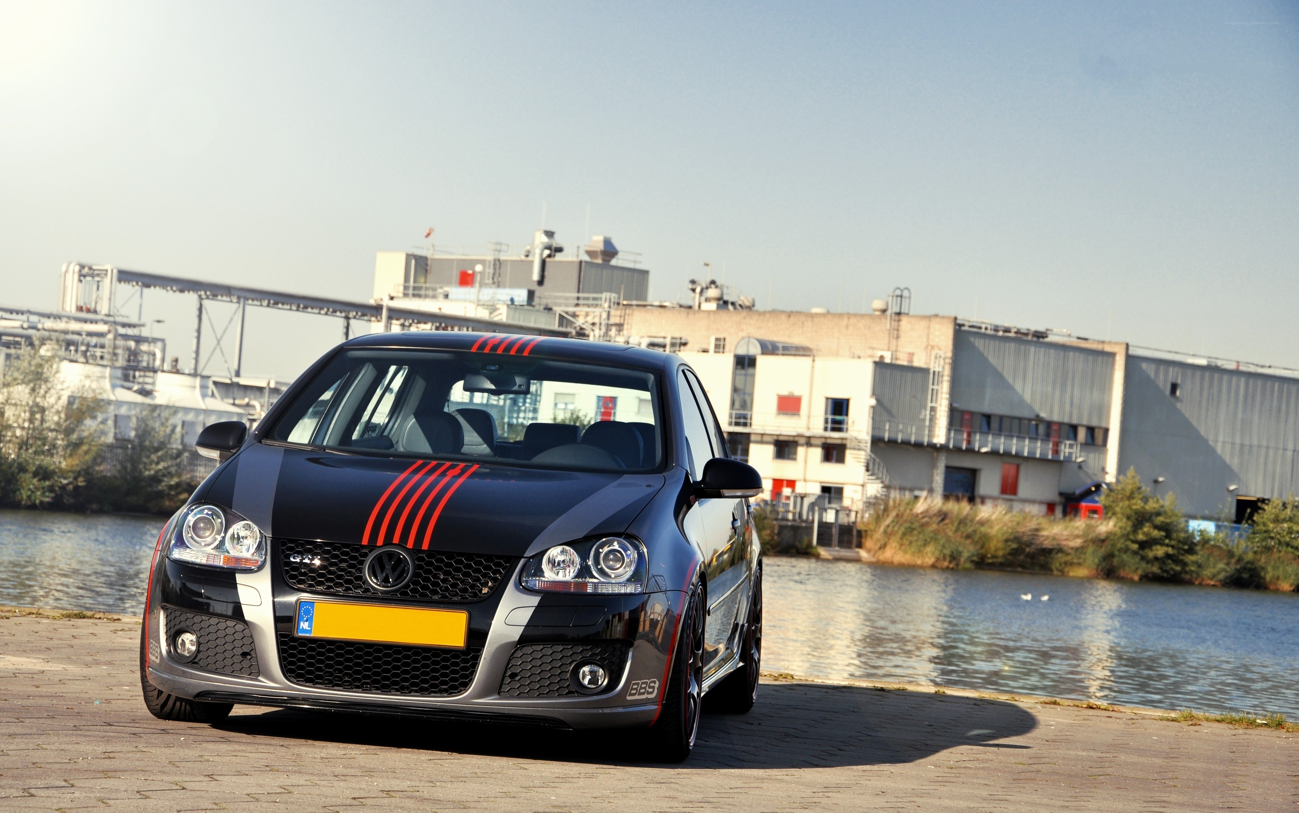 Black VW GTI by the water