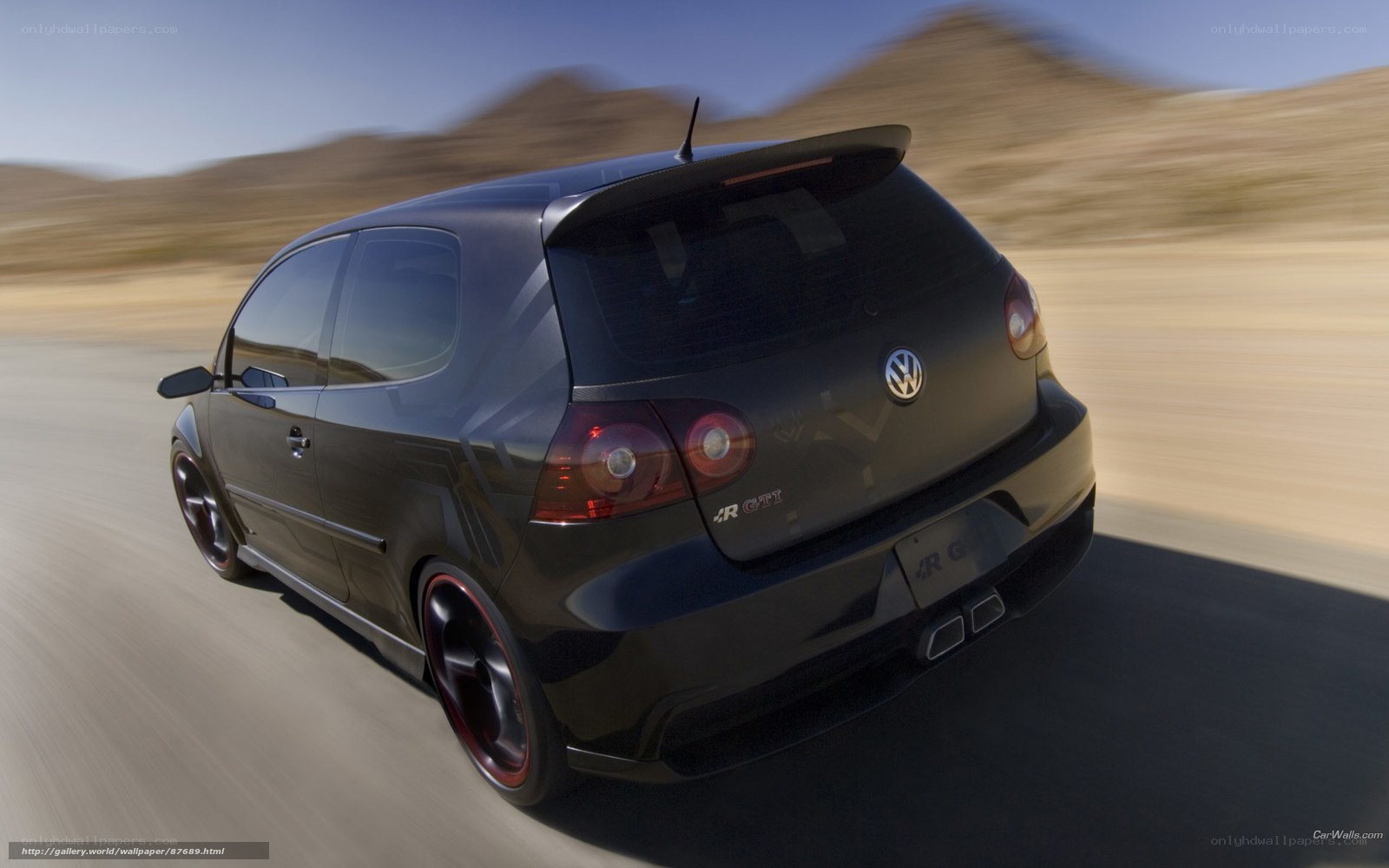 Black VW GTI in motion