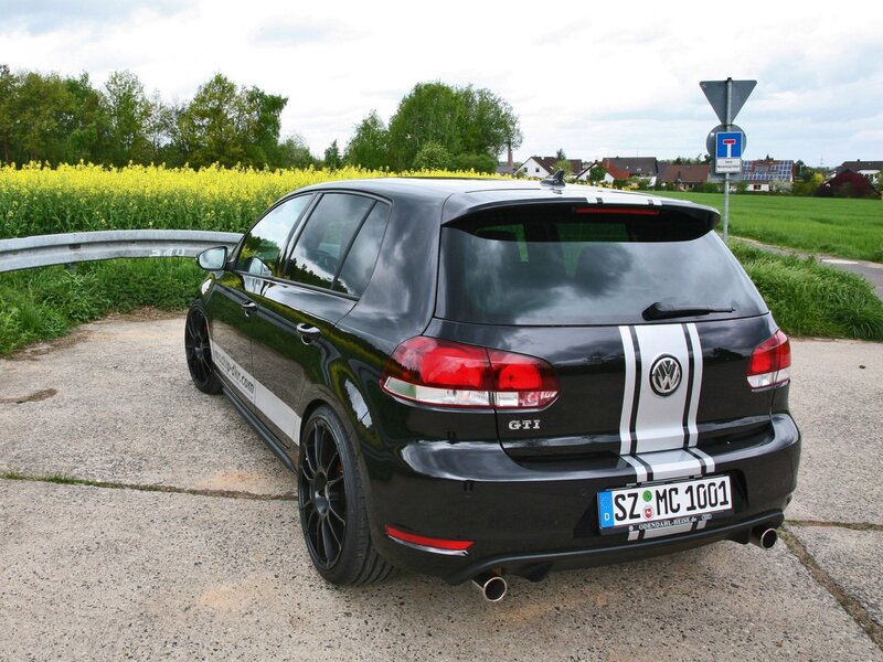 Black VW GTI with racing stripes
