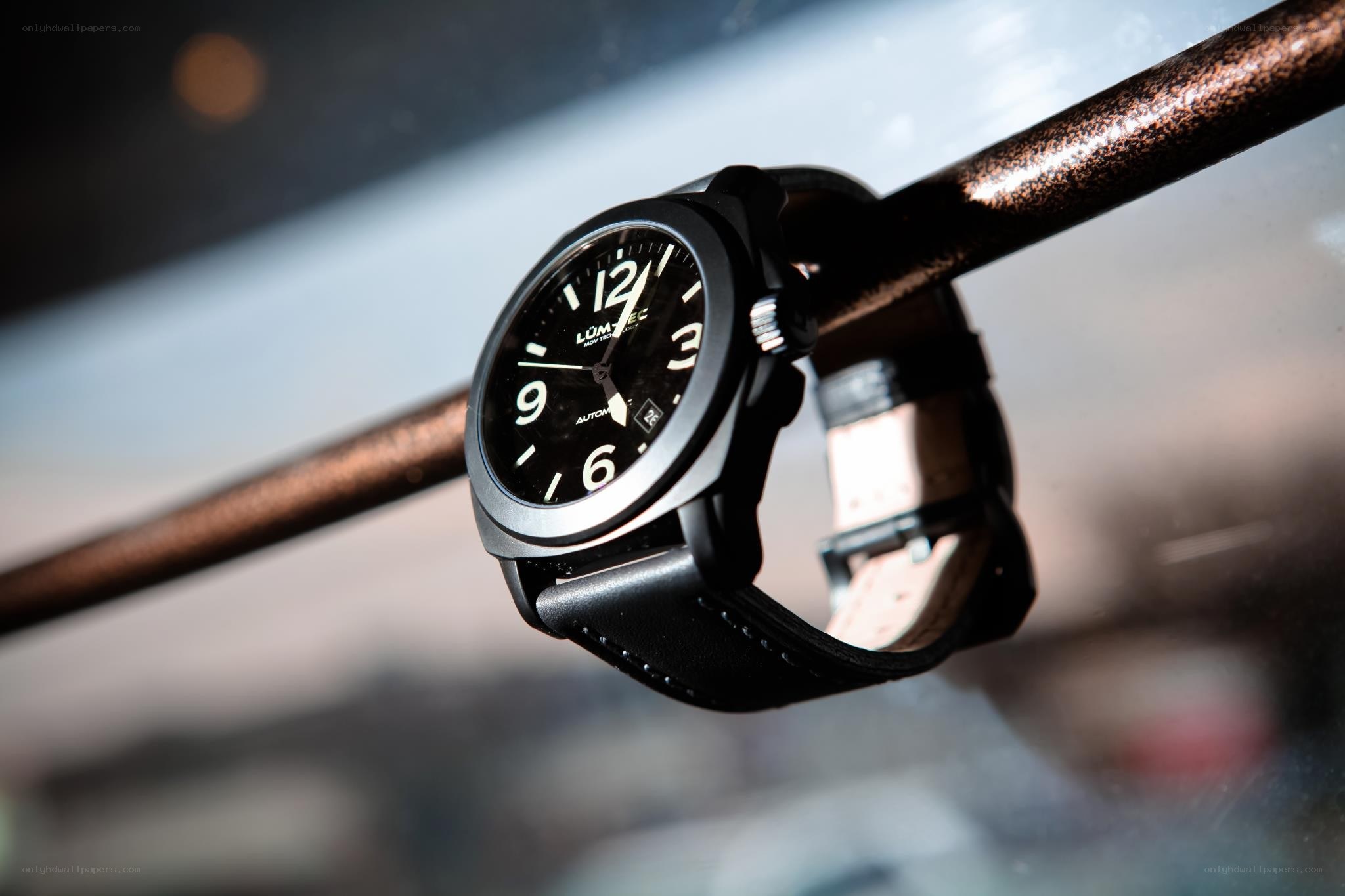 black watch on metal bar