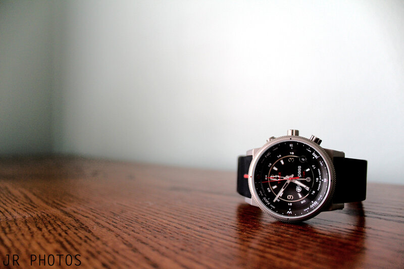 black watch on wooden table