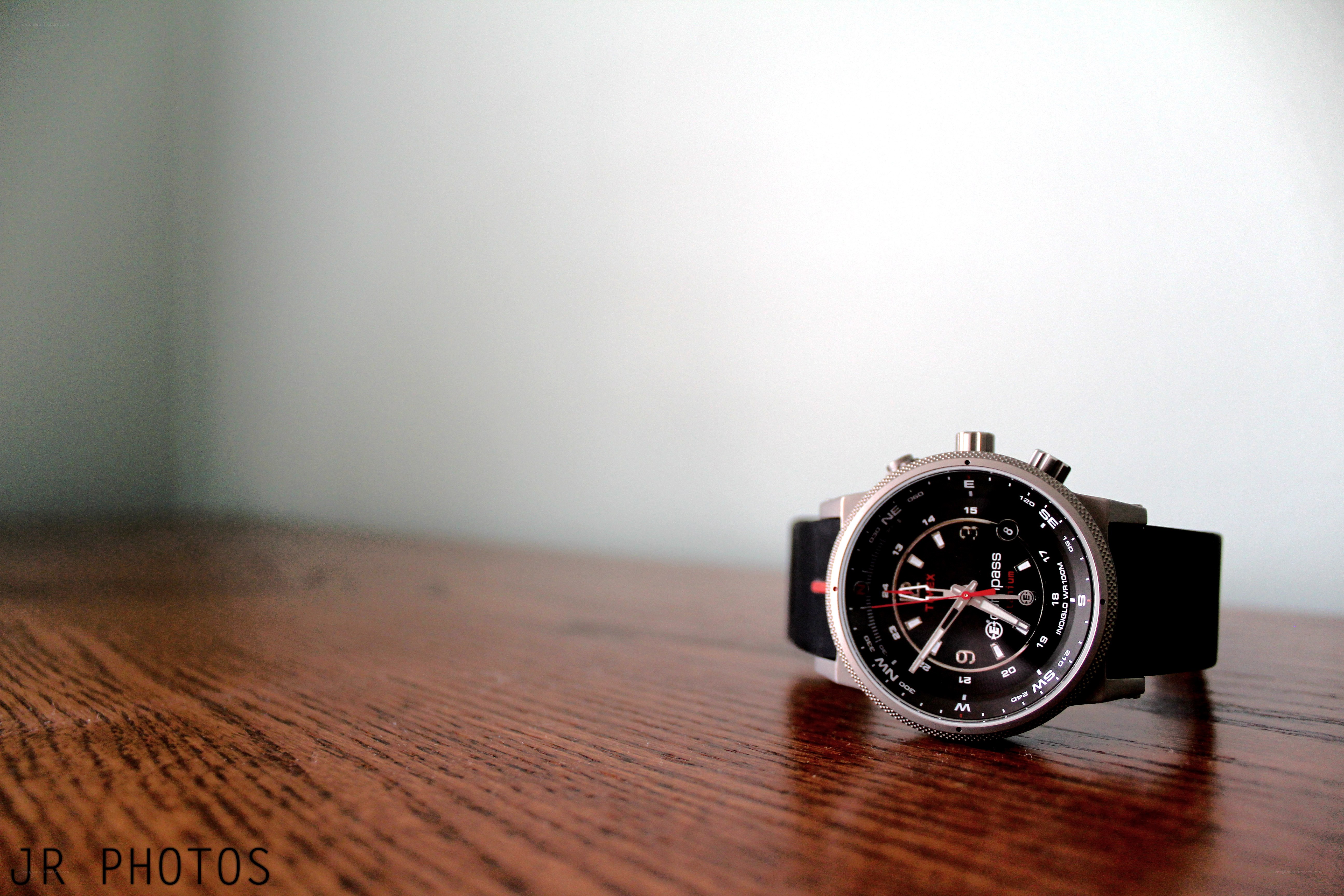 black watch on wooden table