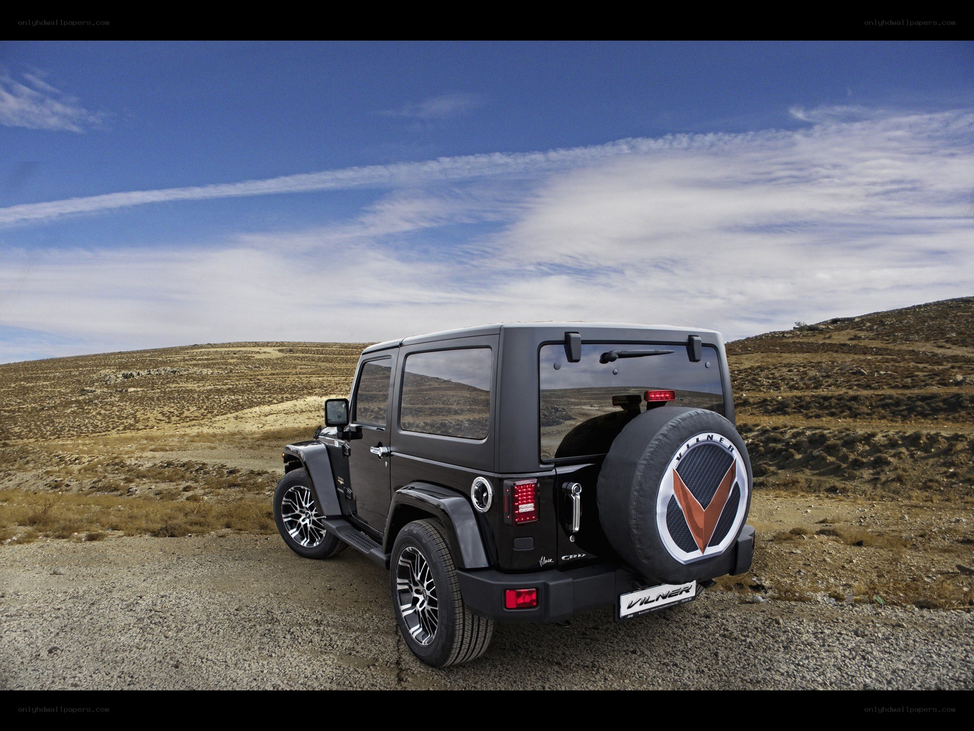 Black Wilner Jeep in desert