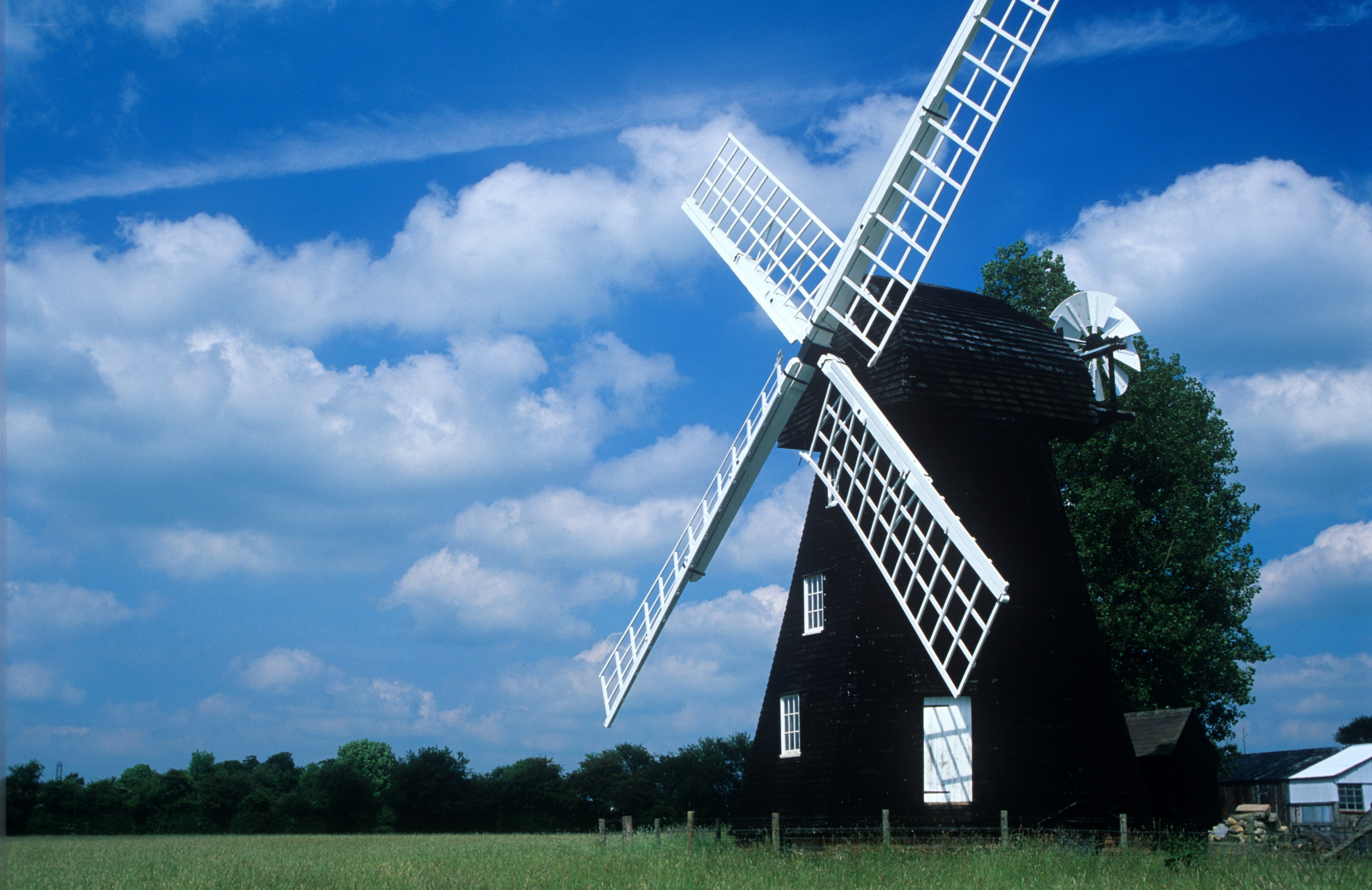 Black windmill under blue sky