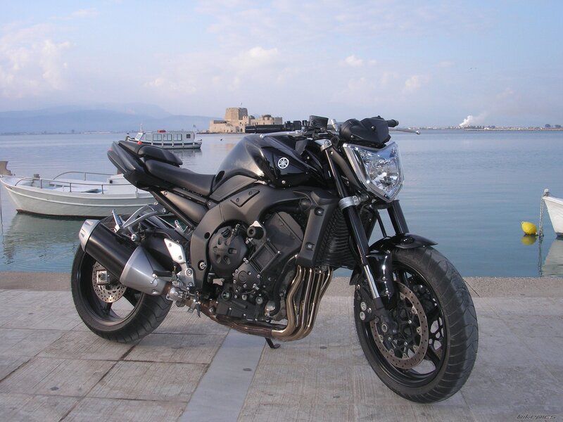 Black Yamaha motorcycle by the sea