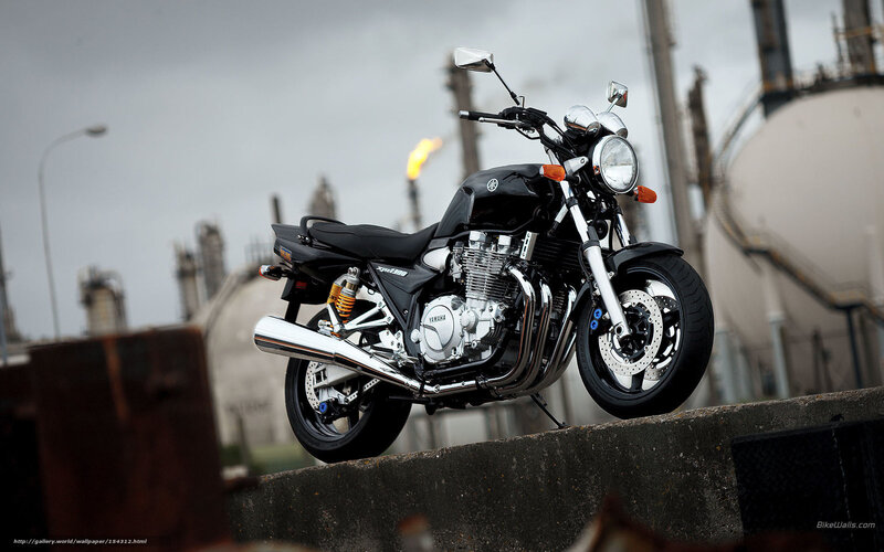 Black Yamaha motorcycle on concrete