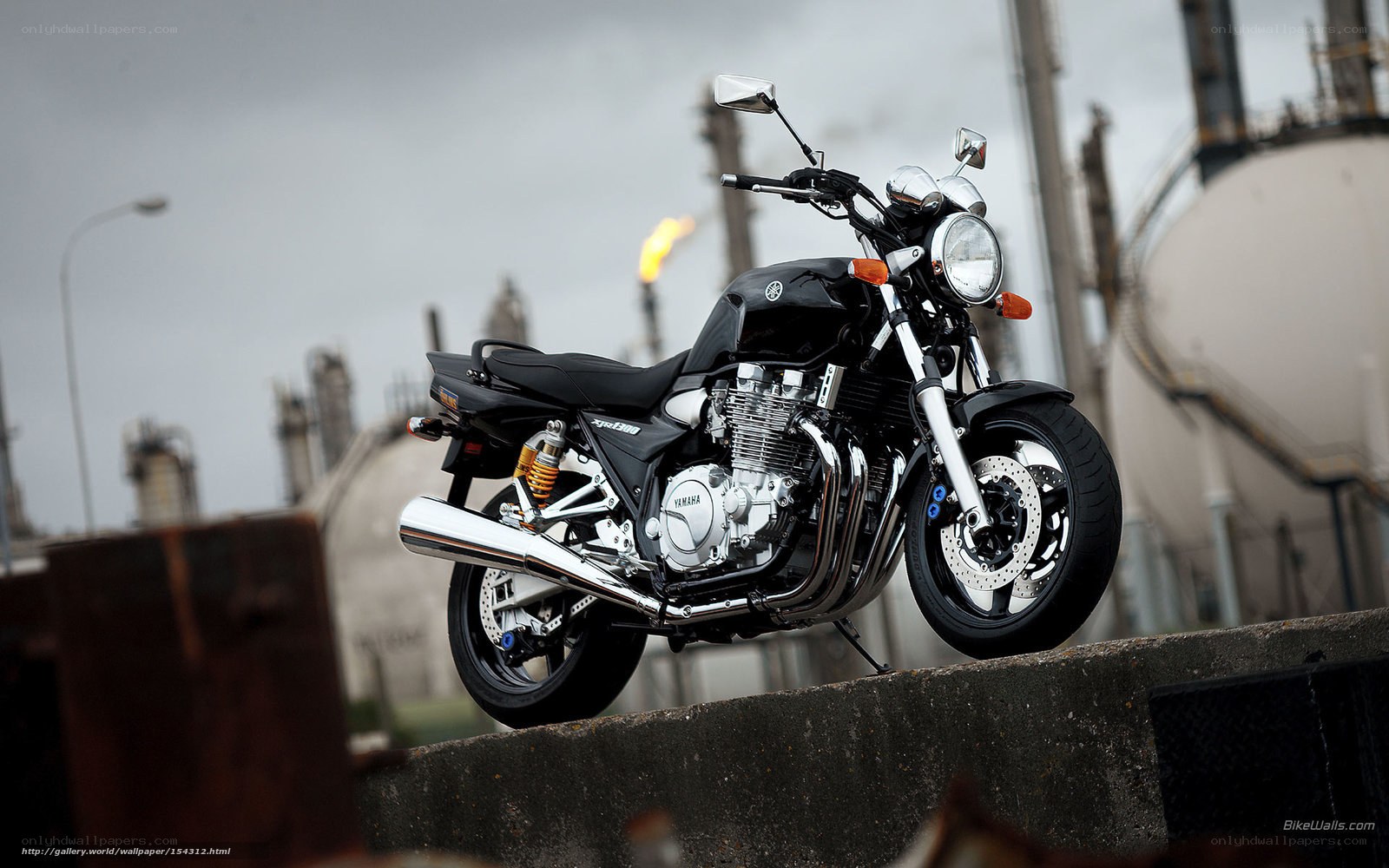 Black Yamaha motorcycle on concrete
