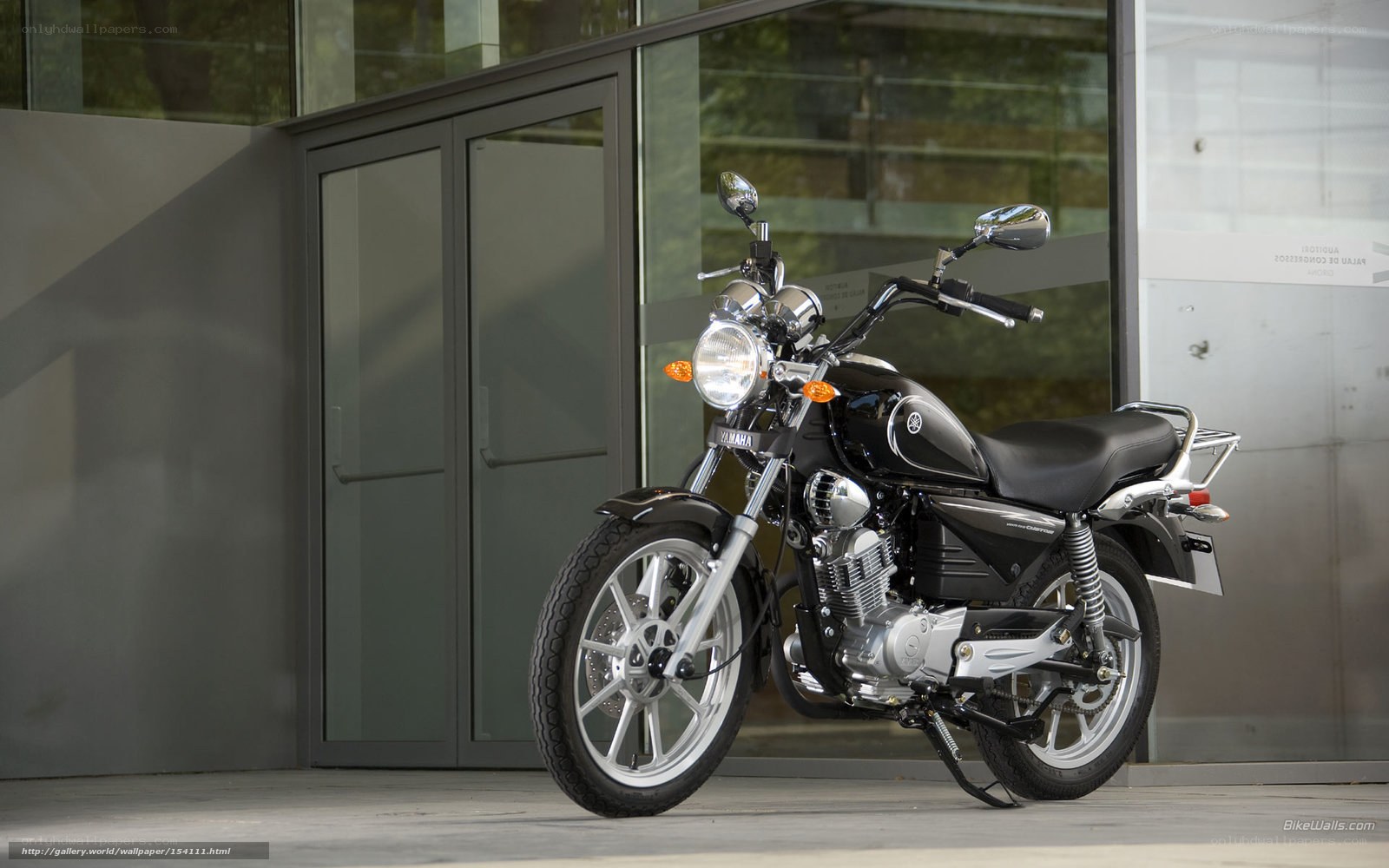 Black Yamaha motorcycle outside building