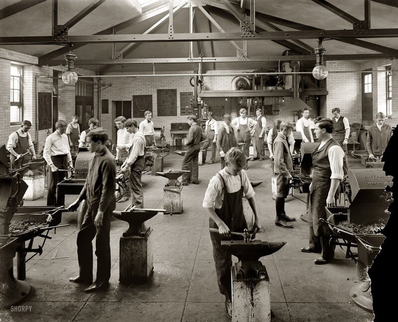 Blacksmiths at work in a workshop