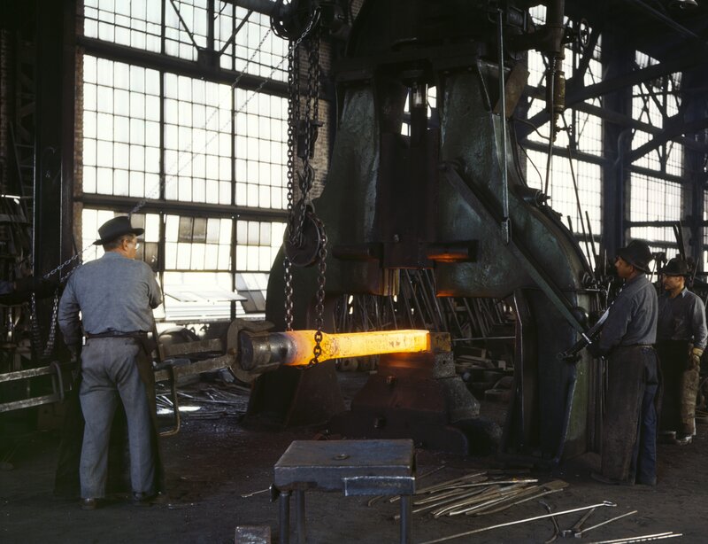 Blacksmiths working with hot metal