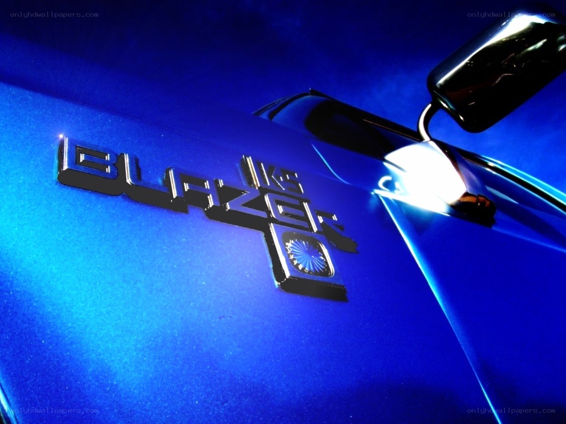 Blazer badge on blue car