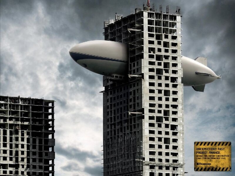 Blimp lifting a building