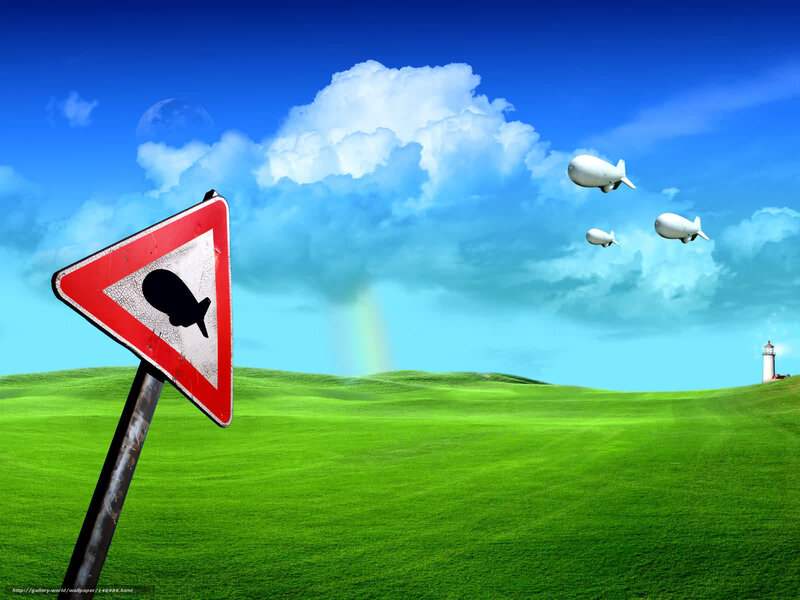 Blimp warning sign in green field
