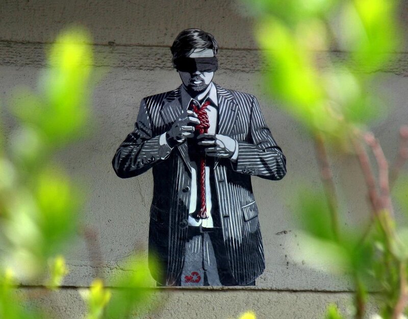 blindfolded man with red rope