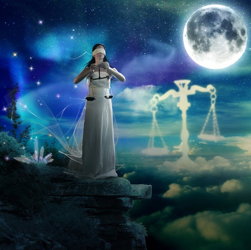 Blindfolded Woman Holding Scales