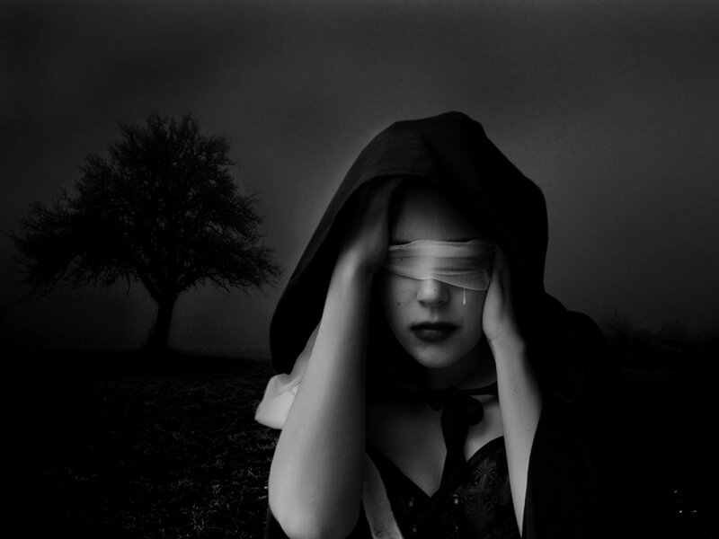 Blindfolded Woman in Hood