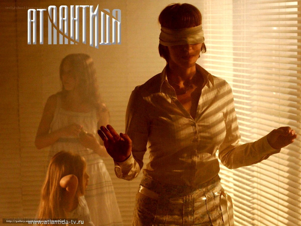 blindfolded woman in room