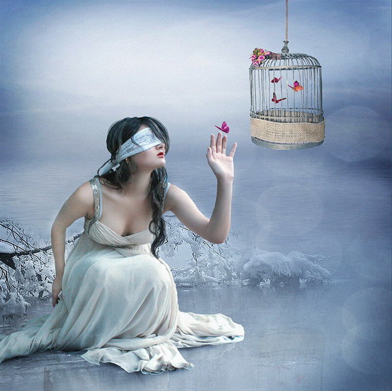 blindfolded woman reaching for birds