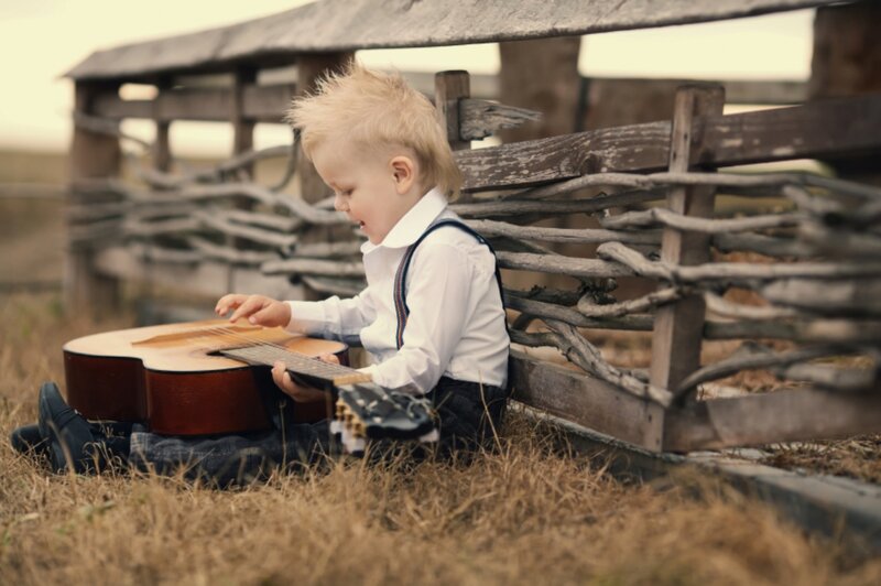 Blonde Boy Playing Guitar