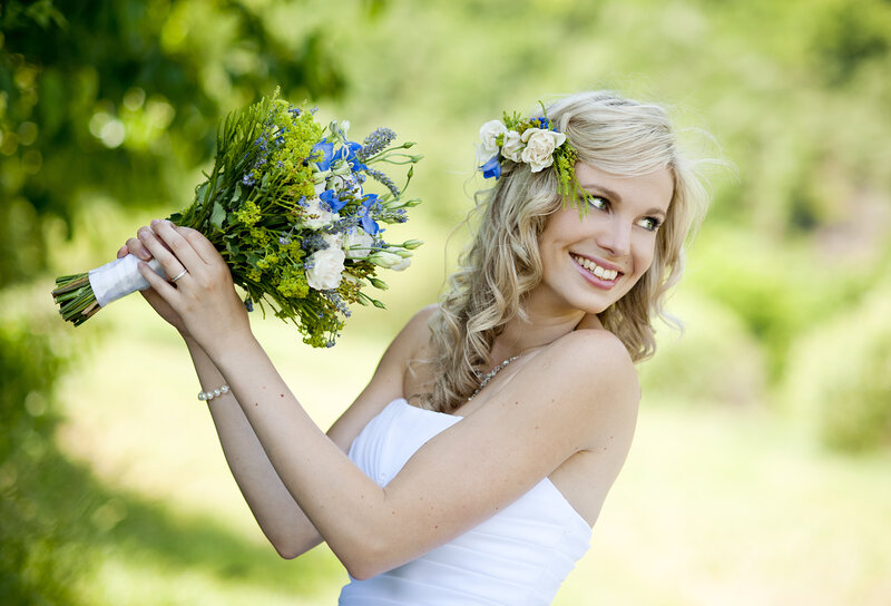 Blonde Bride Holding Bouquet