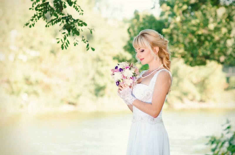 Blonde Bride Holding Bouquet — White, Serene, Afternoon