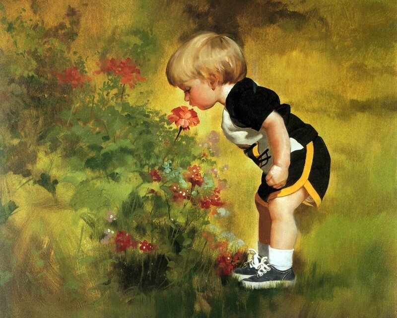 Blonde Child Smelling Flower