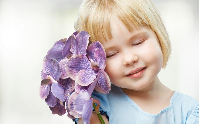 Blonde Child with Orchid