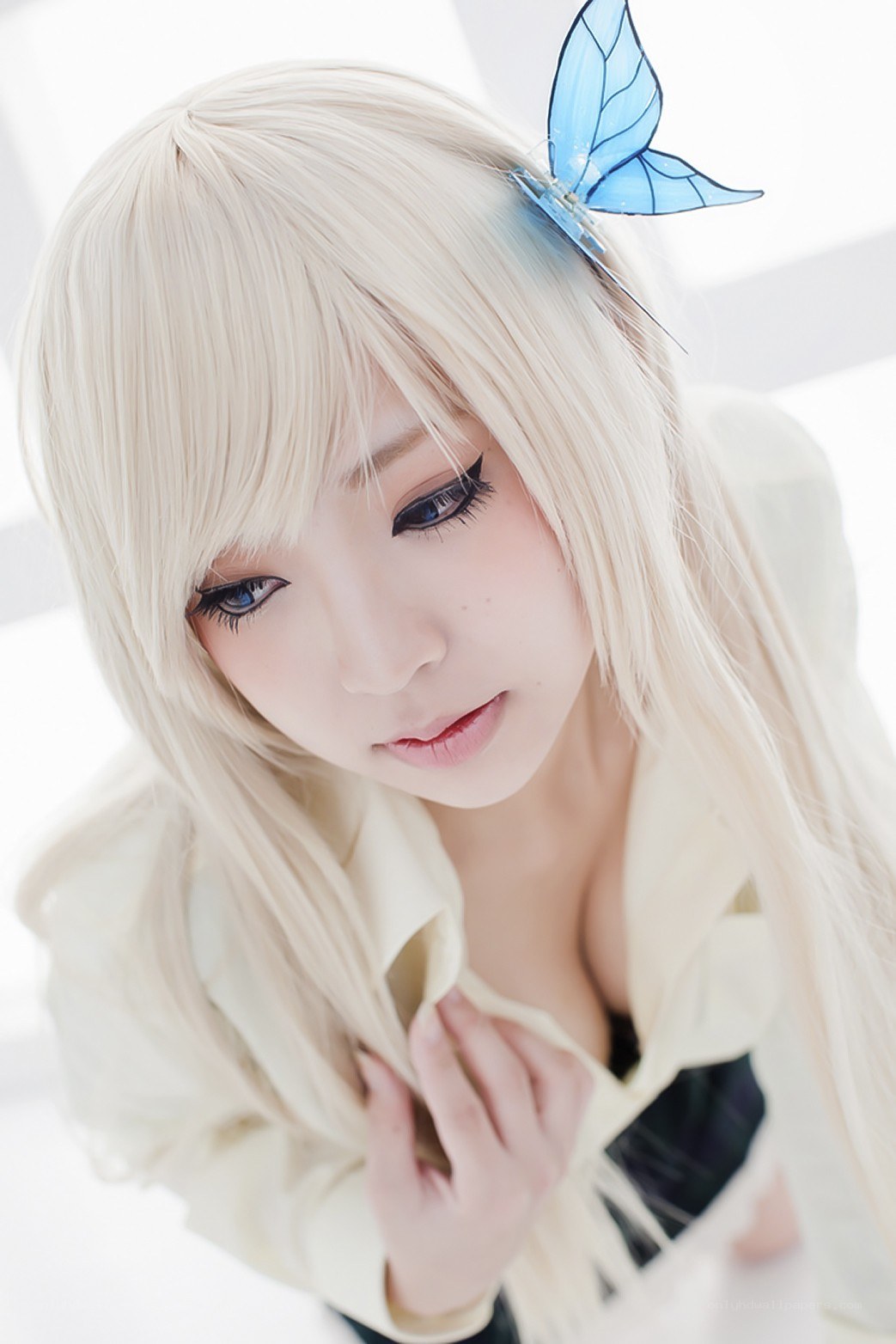 blonde cosplayer with blue butterfly