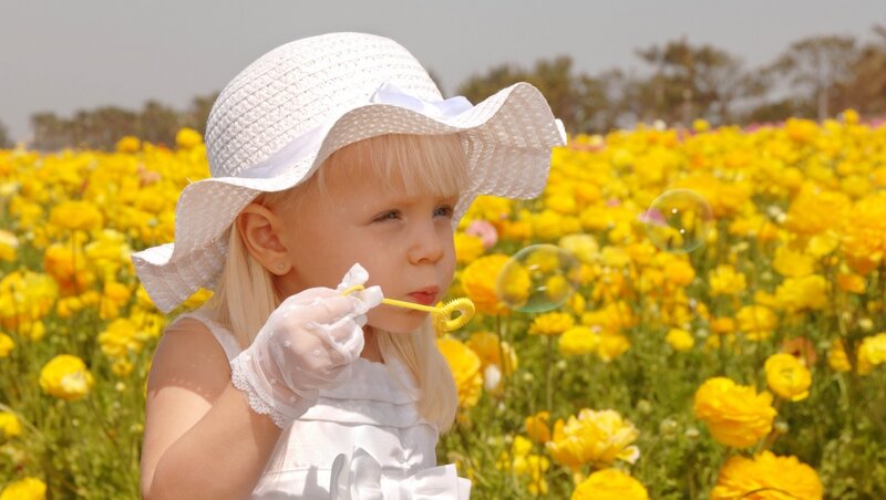 Blonde Girl Blowing Bubbles — Yellow