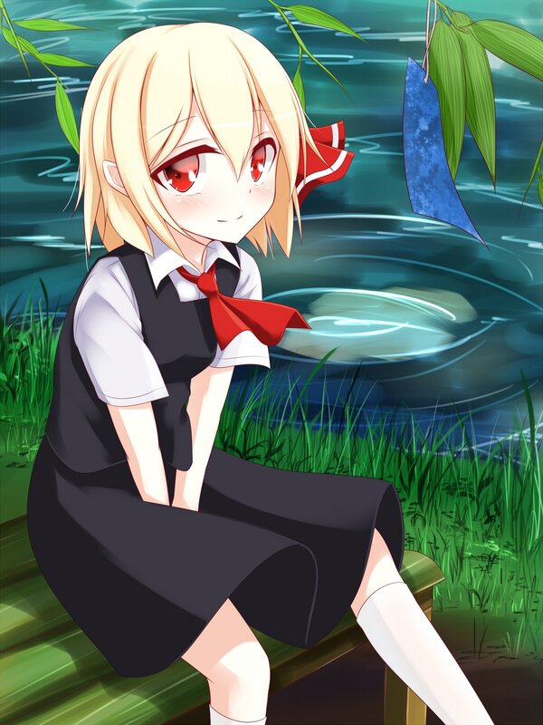 Blonde girl by the pond
