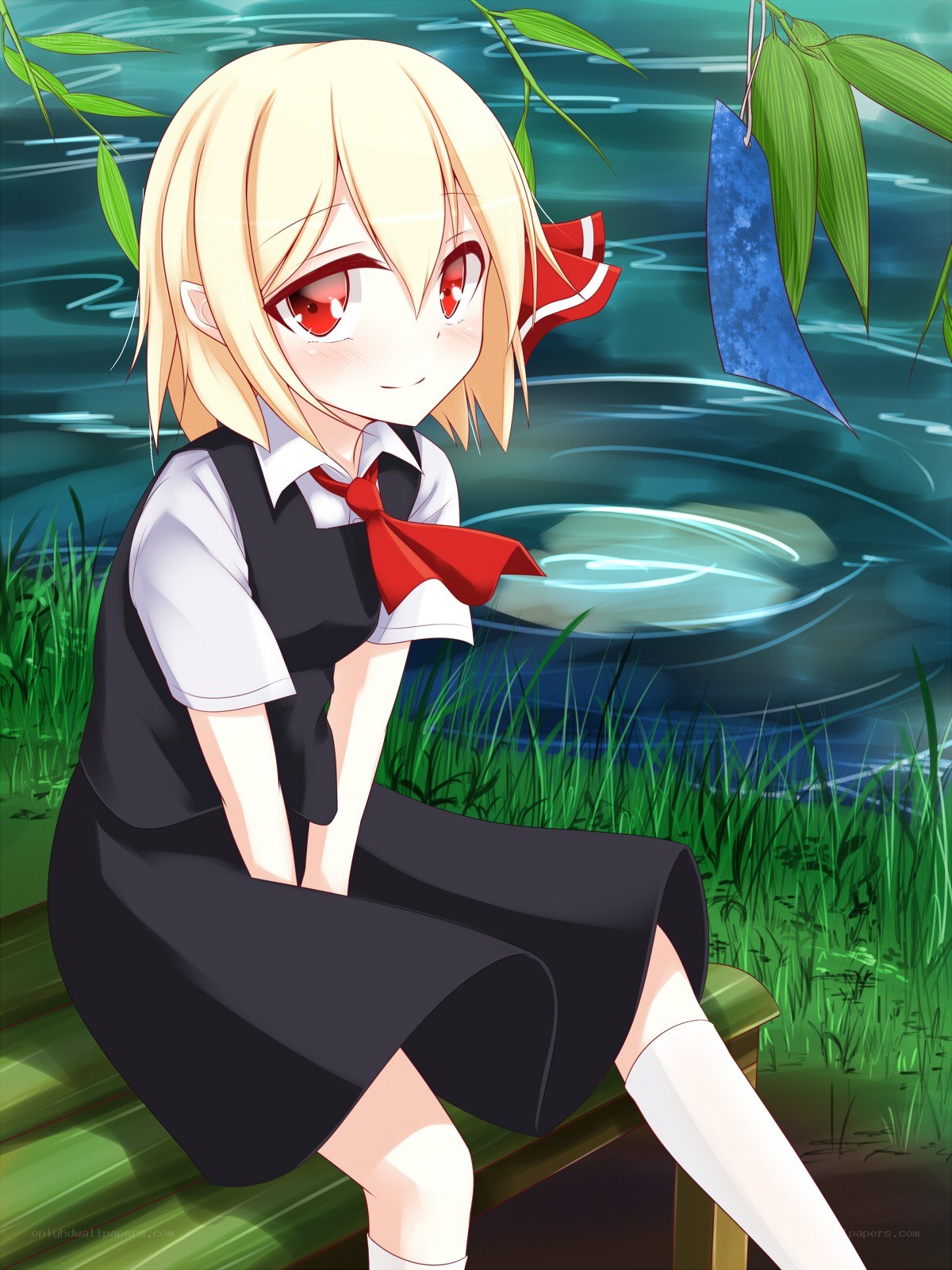 Blonde girl by the pond