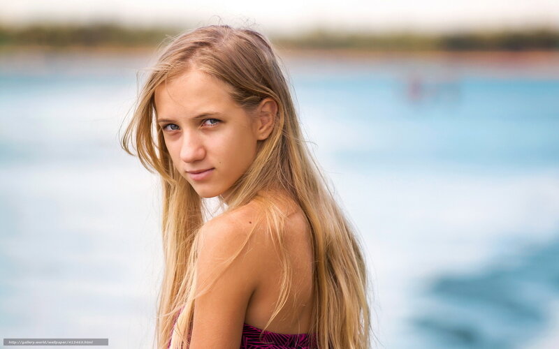 blonde girl by the water