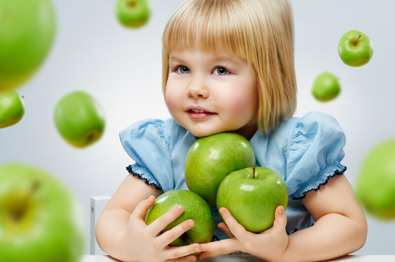 Blonde Girl Holding Apples
