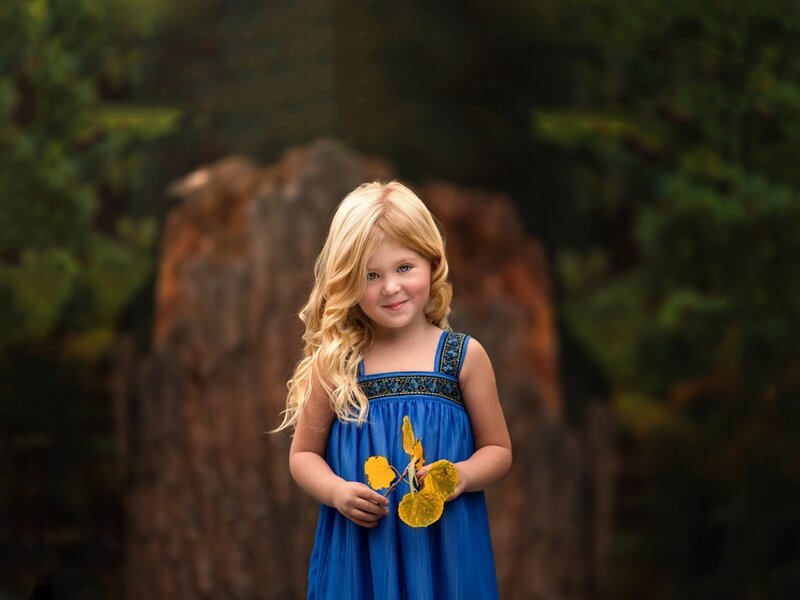Blonde Girl Holding Leaves