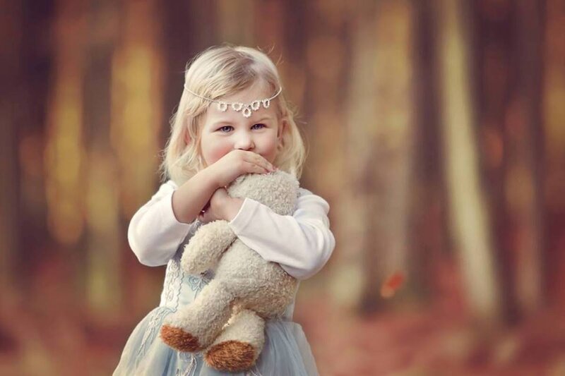 Blonde Girl Holding Teddy Bear — Blue, Serene