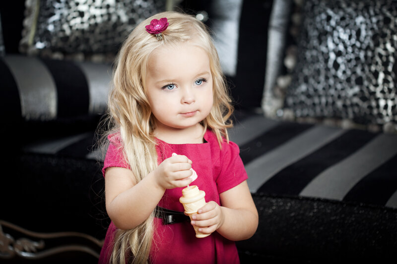 Blonde Girl Holding Toy — Pink