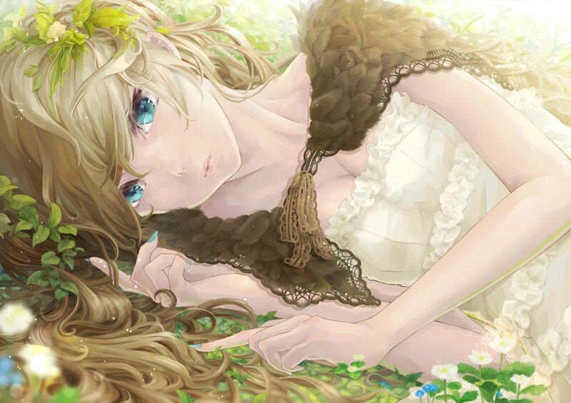 Blonde girl in a flower field