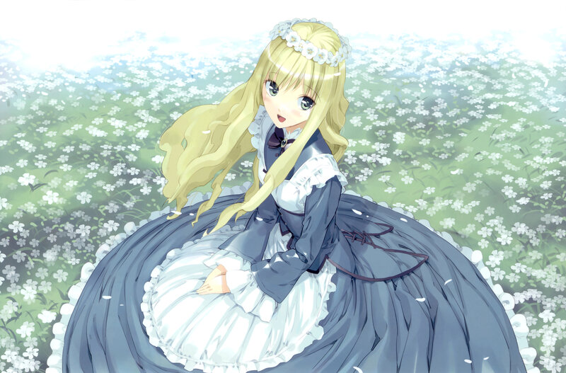 Blonde girl in a flower field