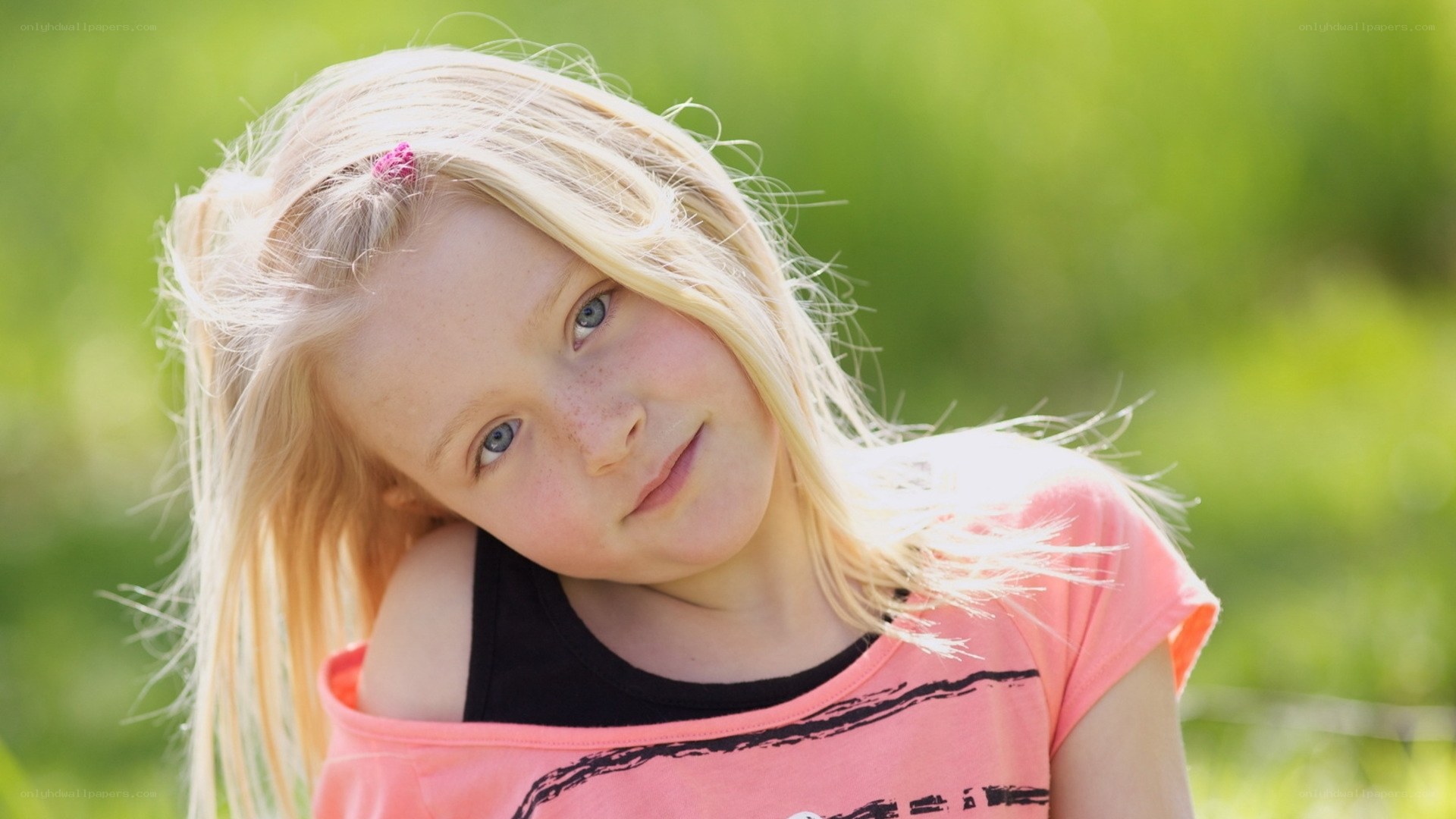 blonde girl in pink shirt