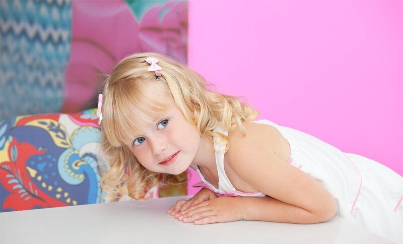 Blonde Girl Lying Down — Pink, Playful