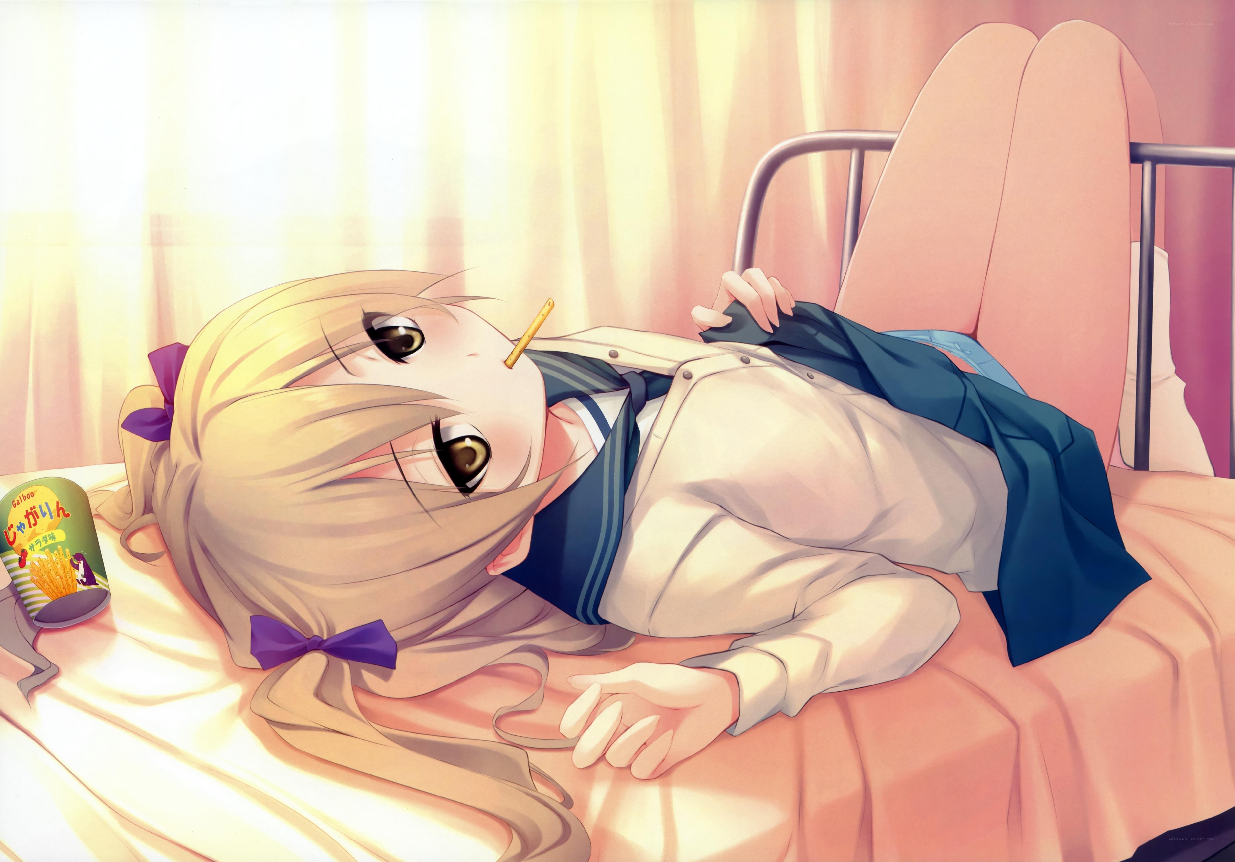 blonde girl lying on bed