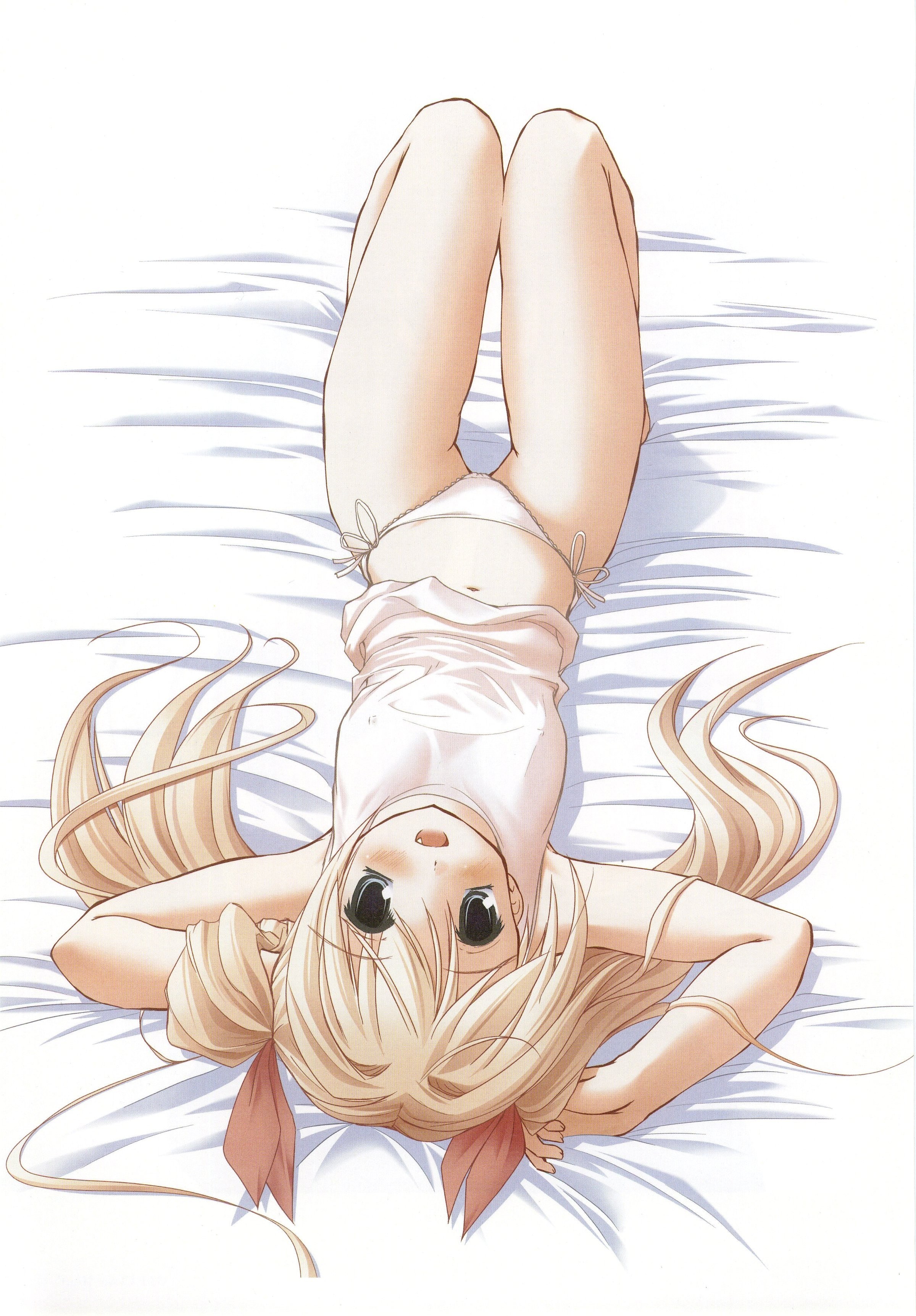 blonde girl lying on bed