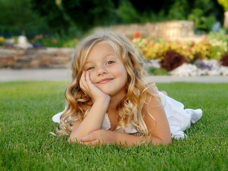Blonde Girl Lying on Grass