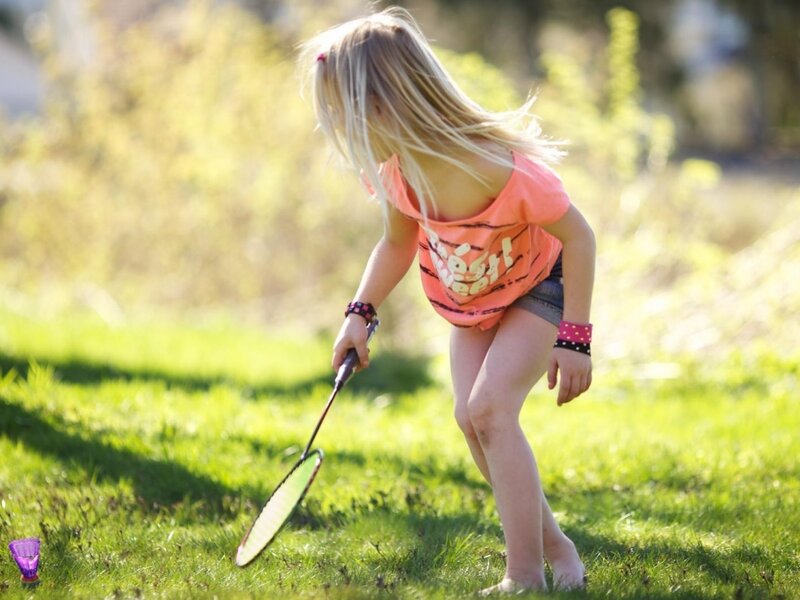 Blonde Girl Playing Badminton