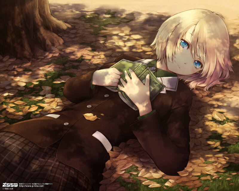 Blonde girl reading in autumn