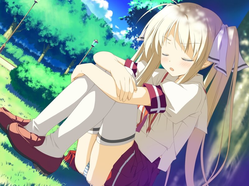 Blonde girl resting in park
