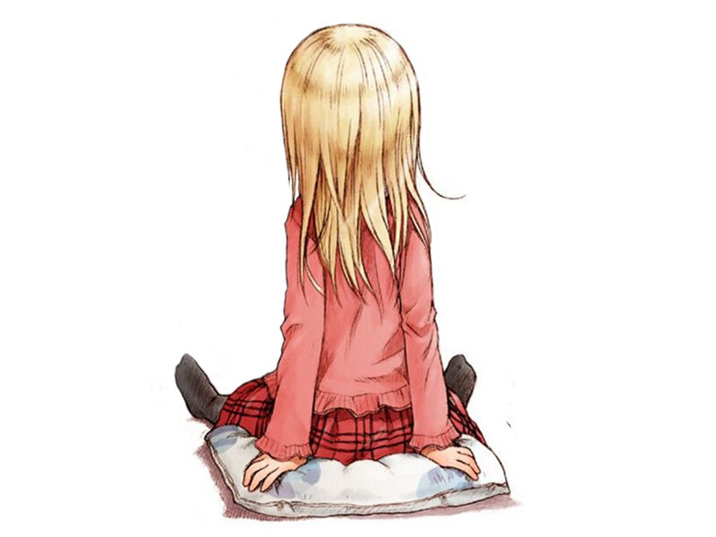 blonde girl sitting on pillow
