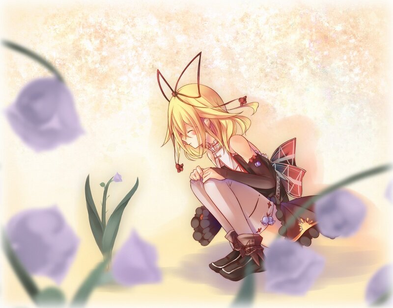 Blonde girl with cat ears in flowers